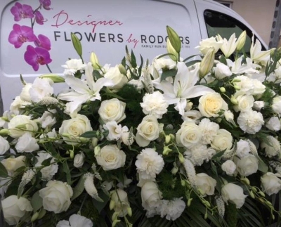 All white Casket spray with Roses and Lilies