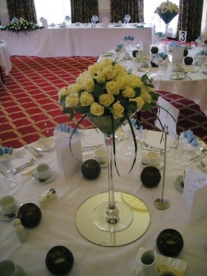 Yellow roses in Martini glass
