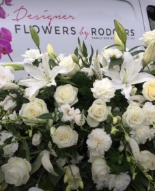 All white Casket spray with Roses and Lilies